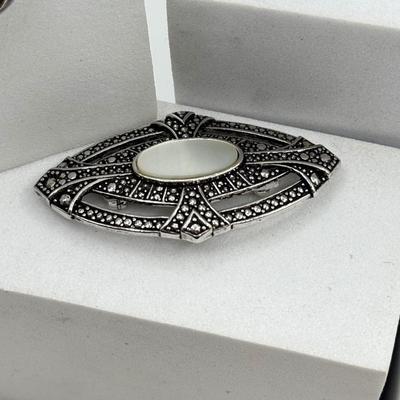 LOT 105: Avon Sterling and Glass Ring (sz 9), Avon Earrings in Box, Faux Marcasite Pieces & More