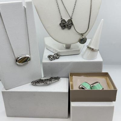 LOT 105: Avon Sterling and Glass Ring (sz 9), Avon Earrings in Box, Faux Marcasite Pieces & More