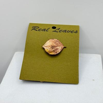 LOT 108: Australian Souvenirs, Heinz Pickle Pin, "Penannular Silver Brooch," Gold Plated Leaf Pins & More