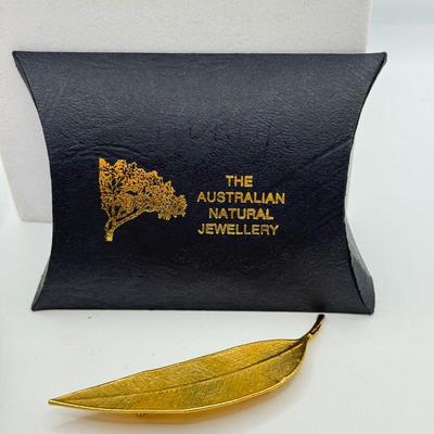 LOT 108: Australian Souvenirs, Heinz Pickle Pin, "Penannular Silver Brooch," Gold Plated Leaf Pins & More