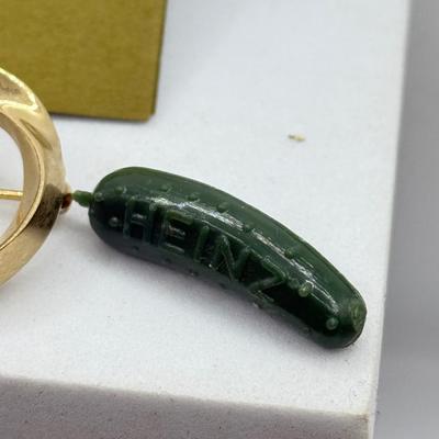 LOT 108: Australian Souvenirs, Heinz Pickle Pin, "Penannular Silver Brooch," Gold Plated Leaf Pins & More