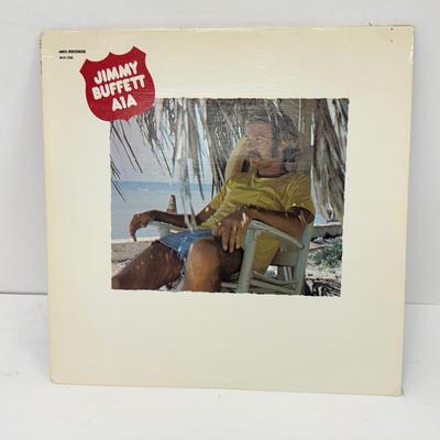 LOT 133: Jimmy Buffett Vinyl Record Albums: Floridays, Changes in Latitudes / Changes in Attitudes, Volcano, A1A, Coconut Telegraph, Last...