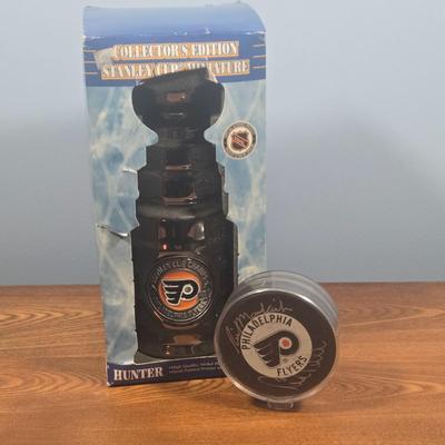 LOT 153: Rick MacLeish and Bill Barber Signed Puck and Collector's Edition Stanley Cup Miniature