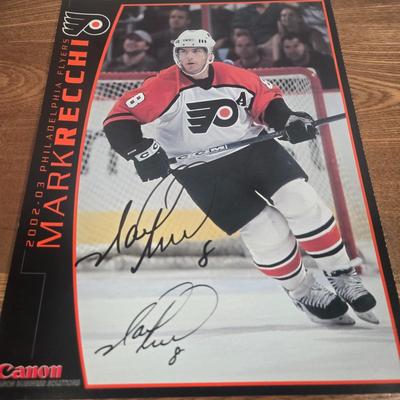 LOT 154: The Philadelphia Flyers at 50 Book, Official Game Program of the 2010 Stanley Cup Final and Players' Signed Photos &...