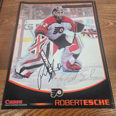 LOT 154: The Philadelphia Flyers at 50 Book, Official Game Program of the 2010 Stanley Cup Final and Players' Signed Photos &...