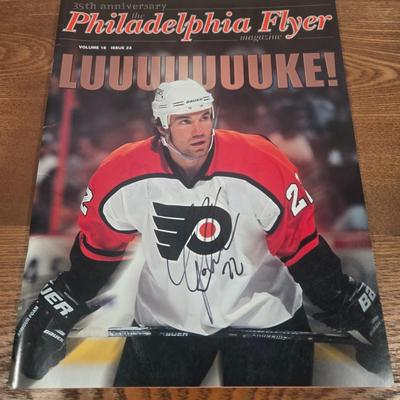 LOT 154: The Philadelphia Flyers at 50 Book, Official Game Program of the 2010 Stanley Cup Final and Players' Signed Photos &...