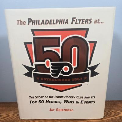 LOT 154: The Philadelphia Flyers at 50 Book, Official Game Program of the 2010 Stanley Cup Final and Players' Signed Photos &...