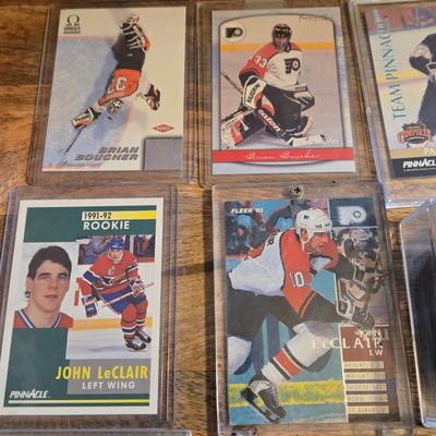 LOT 157: Hockey Cards Featuring Lindros, LeClair, Boucher, and More/ Rod Brind'Amour Autographed Photo with COA, Cards, Bobble Head,...