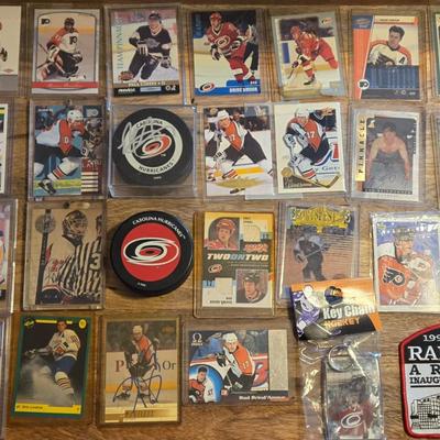 LOT 157: Hockey Cards Featuring Lindros, LeClair, Boucher, and More/ Rod Brind'Amour Autographed Photo with COA, Cards, Bobble Head,...