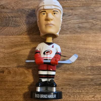 LOT 157: Hockey Cards Featuring Lindros, LeClair, Boucher, and More/ Rod Brind'Amour Autographed Photo with COA, Cards, Bobble Head,...