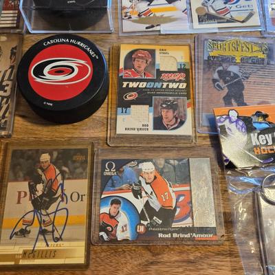 LOT 157: Hockey Cards Featuring Lindros, LeClair, Boucher, and More/ Rod Brind'Amour Autographed Photo with COA, Cards, Bobble Head,...