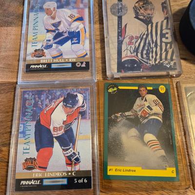 LOT 157: Hockey Cards Featuring Lindros, LeClair, Boucher, and More/ Rod Brind'Amour Autographed Photo with COA, Cards, Bobble Head,...