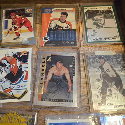 LOT 157: Hockey Cards Featuring Lindros, LeClair, Boucher, and More/ Rod Brind'Amour Autographed Photo with COA, Cards, Bobble Head,...