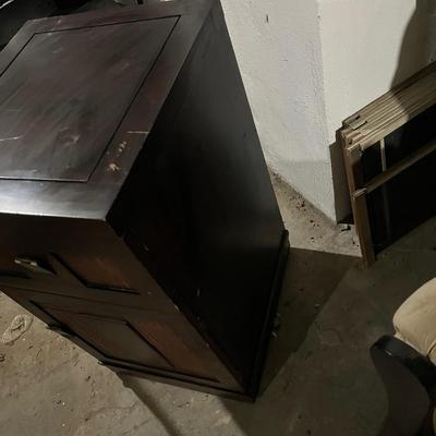 Dark wood nightstand or bedside table