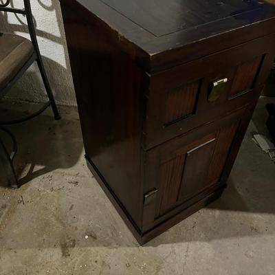 Dark wood nightstand or bedside table