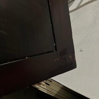 Dark wood nightstand or bedside table