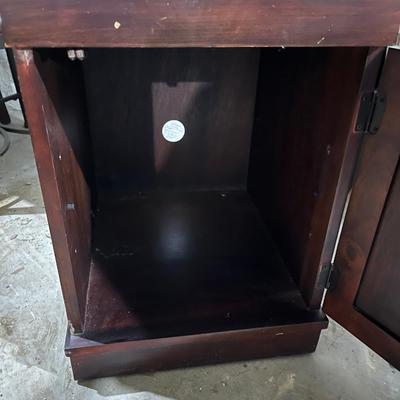 Dark wood nightstand or bedside table