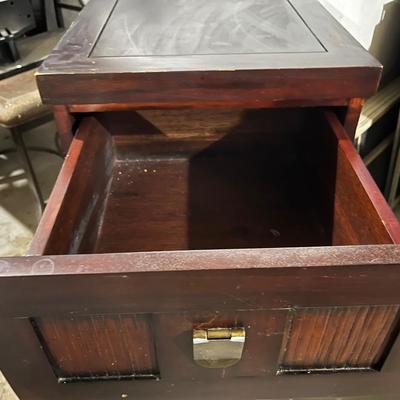 Dark wood nightstand or bedside table