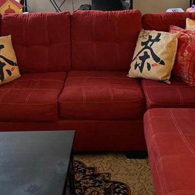 Red L-shaped sectional sofa with a chaise lounge
