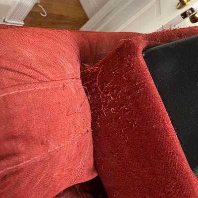 Red L-shaped sectional sofa with a chaise lounge