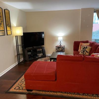 Red L-shaped sectional sofa with a chaise lounge