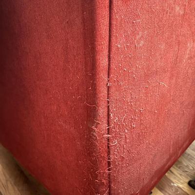 Red L-shaped sectional sofa with a chaise lounge