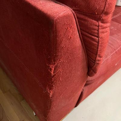 Red L-shaped sectional sofa with a chaise lounge