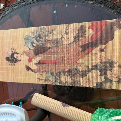 Vintage hanging bamboo scroll featuring Japanese geisha art