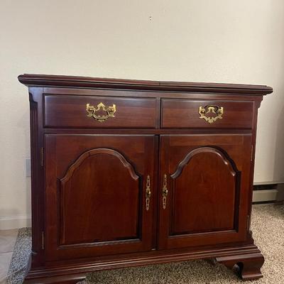 Sale Photo Thumbnail #64: Stunning Thomasville sideboard/buffet cabinet
has floral layment down for protection!