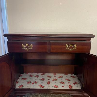 Sale Photo Thumbnail #66: Stunning Thomasville sideboard/buffet cabinet
has floral layment down for protection!