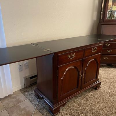 Sale Photo Thumbnail #67: Stunning Thomasville sideboard/buffet cabinet
has floral layment down for protection!