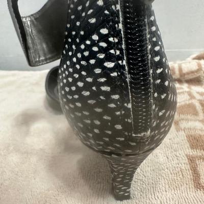 Tahari black ankle-strap heels with a snakeskin-print trim.