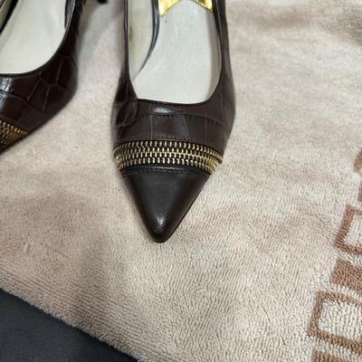 Michael Michael Kors brown crocodile-embossed leather pumps with a gold zipper detail on the toe.
