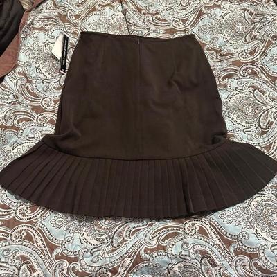 Brown Briggs New York A-line skirt with a pleated hem and a stretch fabric blend.