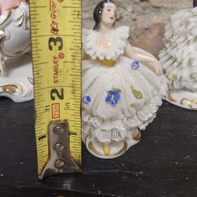Sale Photo Thumbnail #69: Really neat porcelain ruffles figures. These are super delicate and they all have some damage. Lot 1