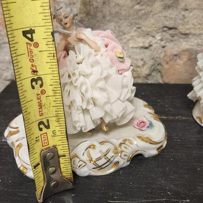 Sale Photo Thumbnail #65: Really neat porcelain ruffles figures. These are super delicate and they all have some damage. Lot 1