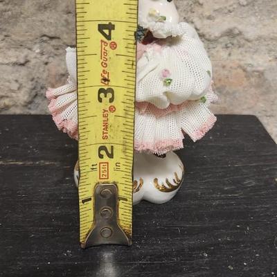 Sale Photo Thumbnail #75: Really neat porcelain ruffles figures. These are super delicate and they all have some damage. Lot 1