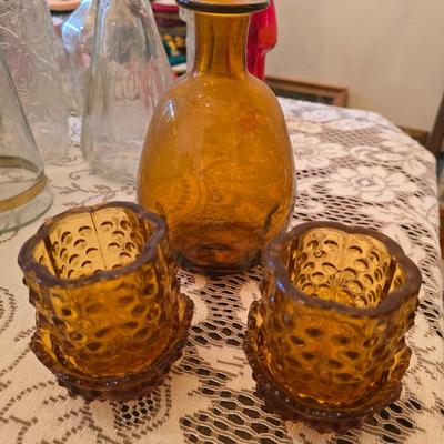 Amber glass decanter and candle holders