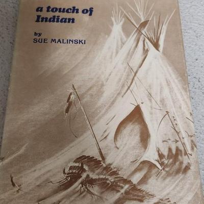 Sale Photo Thumbnail #207: A touch of Indian book and framed artwork.