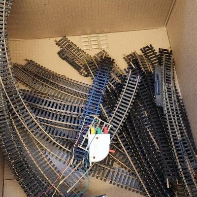 Sale Photo Thumbnail #632: I know very little about trains but this has a Tycoscene in box an over and under set, 4 cars, one engine and a bunch of tracks.