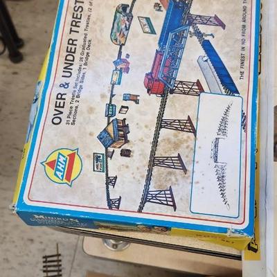 Sale Photo Thumbnail #621: I know very little about trains but this has a Tycoscene in box an over and under set, 4 cars, one engine and a bunch of tracks.