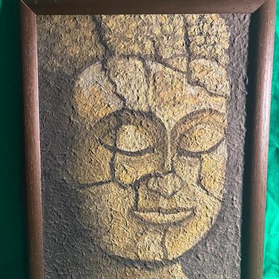 Sale Photo Thumbnail #4: Framed Buddha face artwork featuring a textured, stone-like surface with an abstract design emphasizing cracks and contours. The piece is mounted in a simple dark wood frame. Represents rich cultural or spiritual significance. Dimensions and artist are un