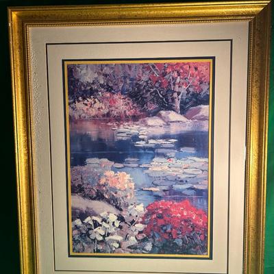 Sale Photo Thumbnail #9: Framed artwork depicting a serene landscape featuring a pond surrounded by colorful foliage. The print is set in a gold-tone frame with a double matte, including an inner yellow matte and an outer off-white matte. Condition of the frame and print is good,