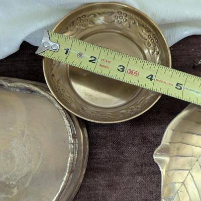 Group of four brass pieces