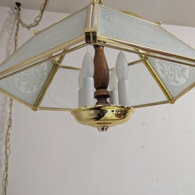 Hanging light with electric cord, and long chain.