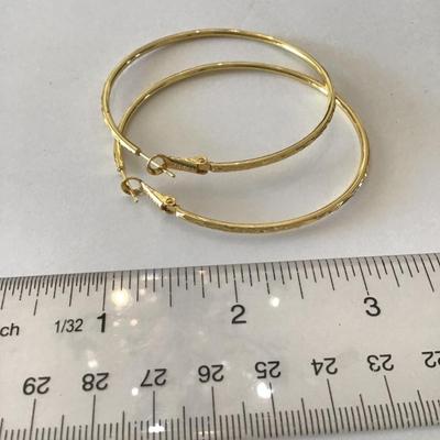 Beautiful Marked. Very nice gold tone, hoop earrings.