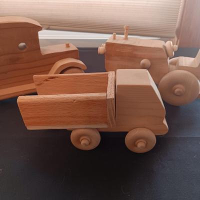 HAND CRAFTED WOODEN TOYS WITH AN EMBEDDED PENNY FOR THE YEAR THEY WERE MADE