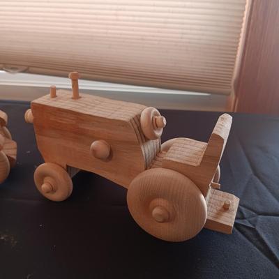 HAND CRAFTED WOODEN TOYS WITH AN EMBEDDED PENNY FOR THE YEAR THEY WERE MADE