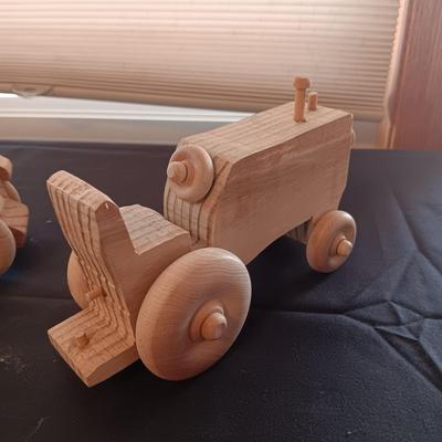 HAND CRAFTED WOODEN TOYS WITH AN EMBEDDED PENNY FOR THE YEAR THEY WERE MADE
