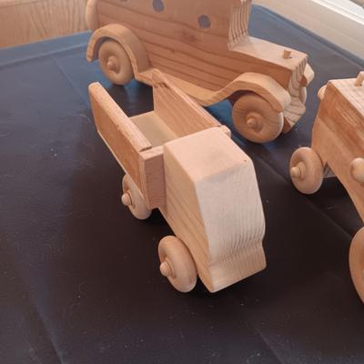 HAND CRAFTED WOODEN TOYS WITH AN EMBEDDED PENNY FOR THE YEAR THEY WERE MADE